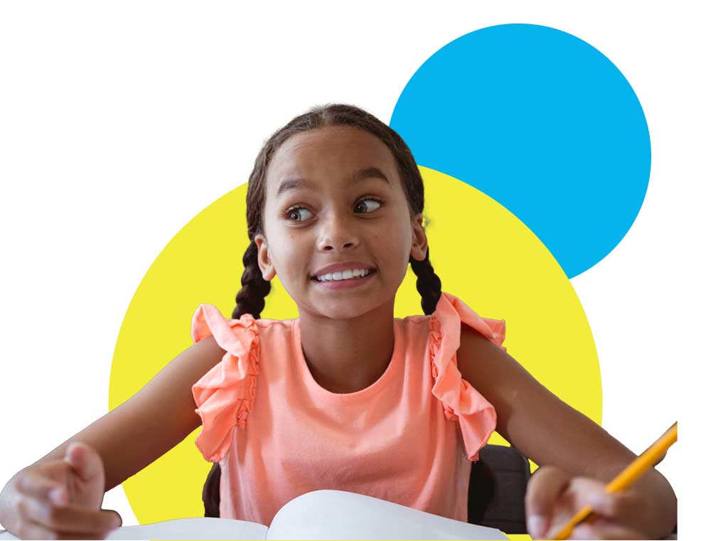 Smiling girl with braids holding a pencil and sitting at a desk with an open notebook, ready to learn.