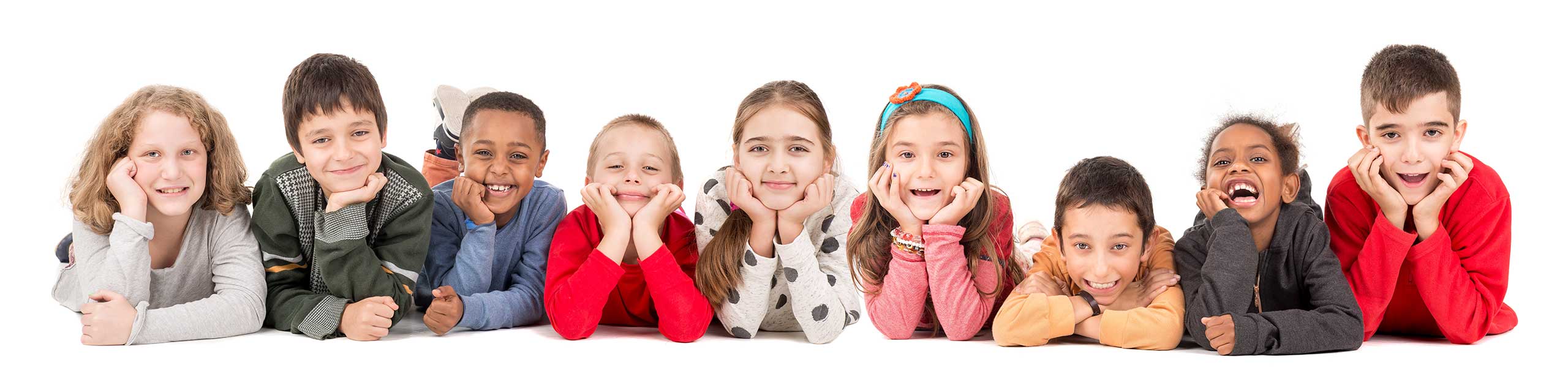 Group of ten diverse, smiling children lying on their stomachs with their chins in their hands, expressing happiness and friendship across various ethnicities and styles.